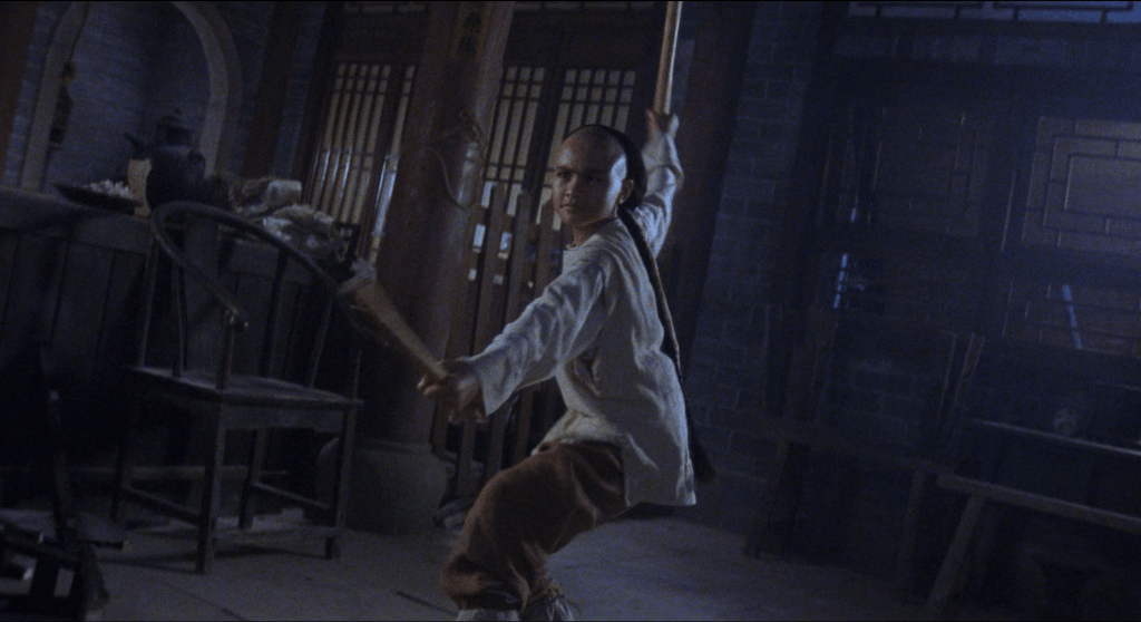 Angie Tsang as Wong Fei-Hung adopting a fighting stance.
