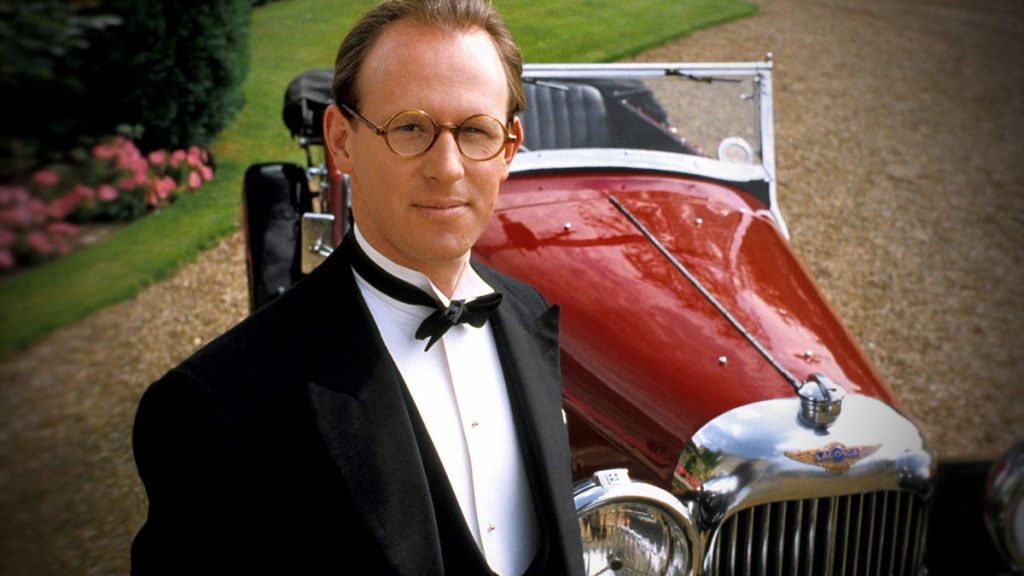 Peter Davison as "Campion" next to a classic car: the Lagonda Tourer.